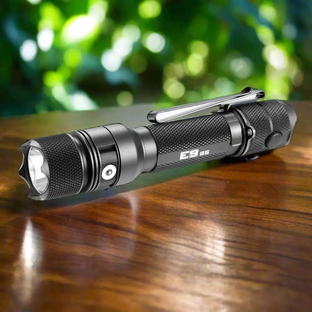Powertac E9 Gen5 EDC rechargeable tactical flashlight on wooden surface