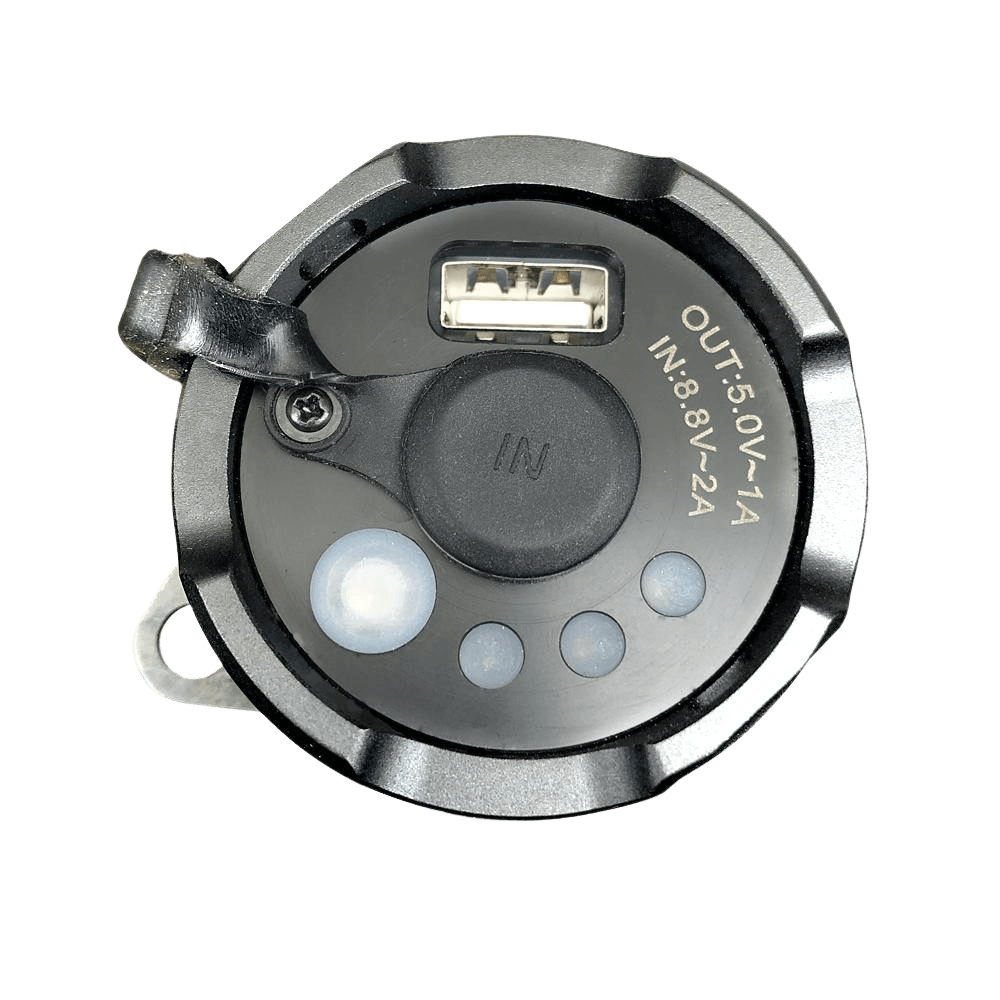 Circular metallic device with USB port and LED lights on a gray background